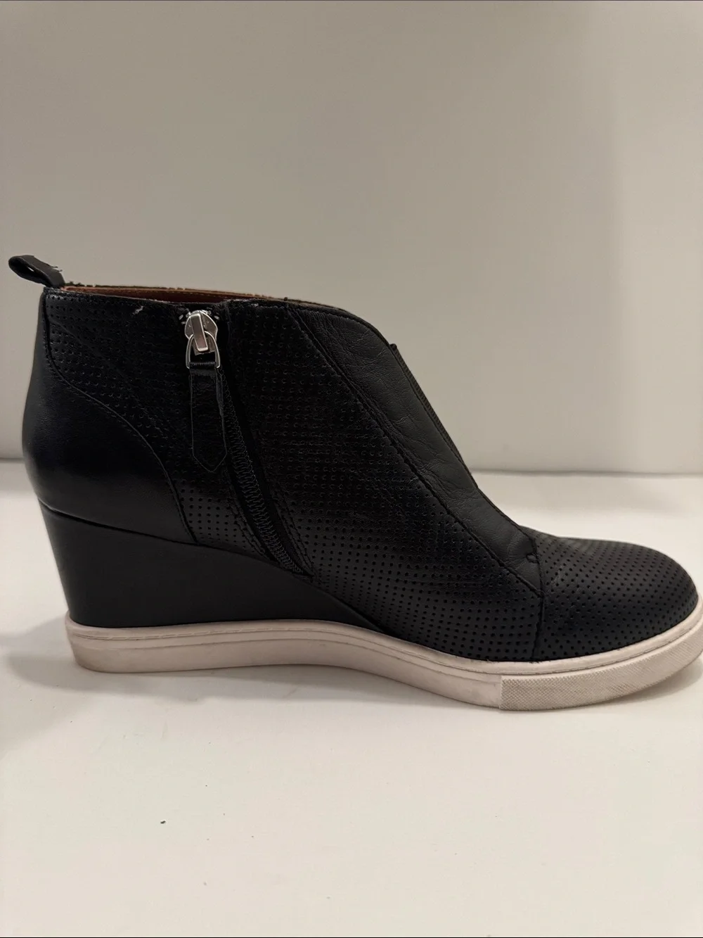 L.Paolo Women’s Black Leather Perforated Wedge Sneakers